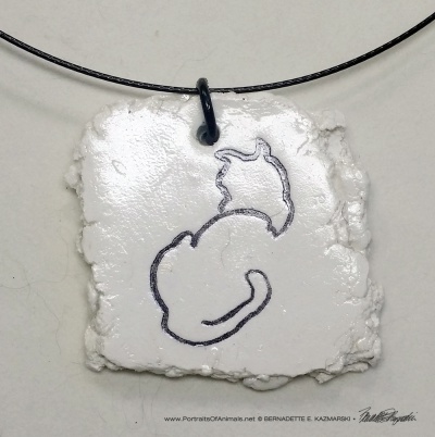 "Back to Front" pendant, 1.5" x 1.5" irregular on wire cord.