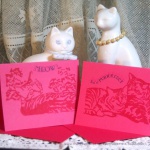 Red cards, two designs.