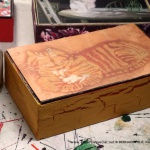 The orange batik kitty was just asking to be on the El Producto box.