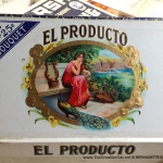 The detailed, colorful and embossed art on the inside of the El Producto box.