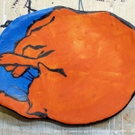Orange and blue with black, "The Big Nap" decorative dish.