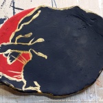 Black and red with gold, "The Big Nap" decorative dish.