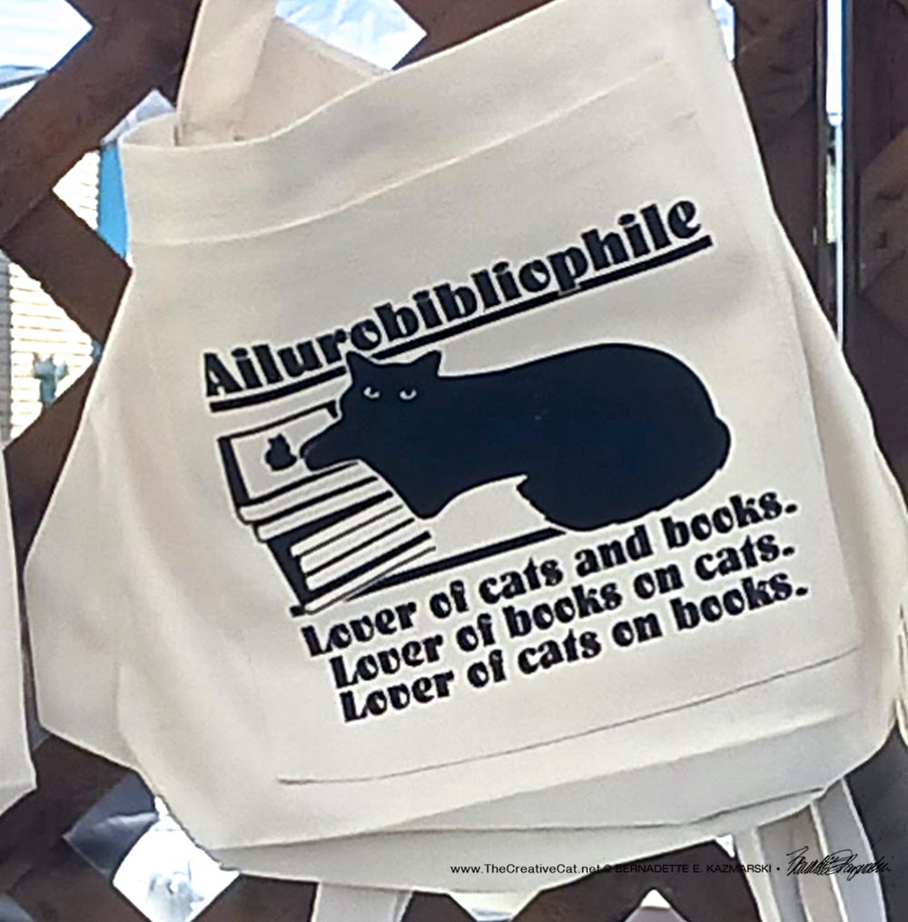 Ailurobibliophile extra-large tote bag style with front pocket.
