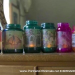 Upcycled glass jar votives in summery colors.
