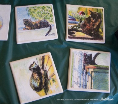 A set of tiles with art in similar style and media.