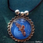 Red Tail cabochon pendant.