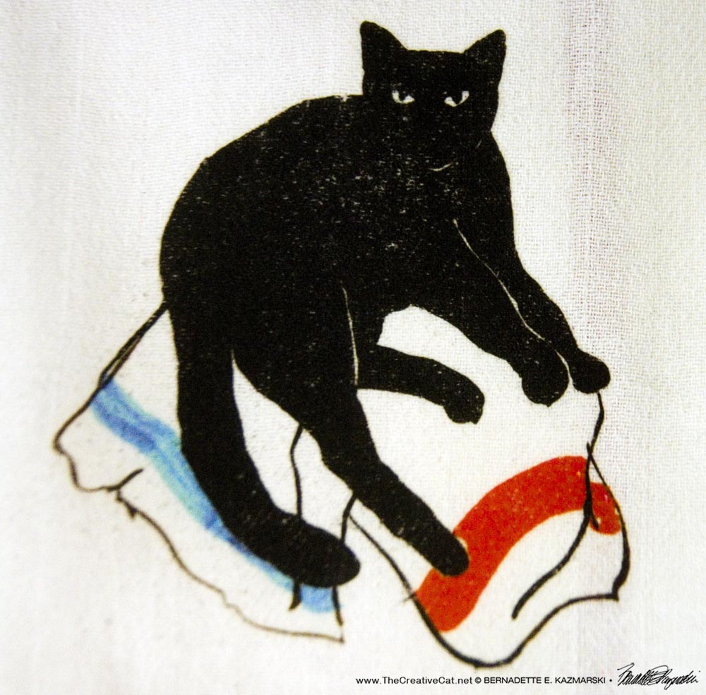 handprinted dishtowel with black cat