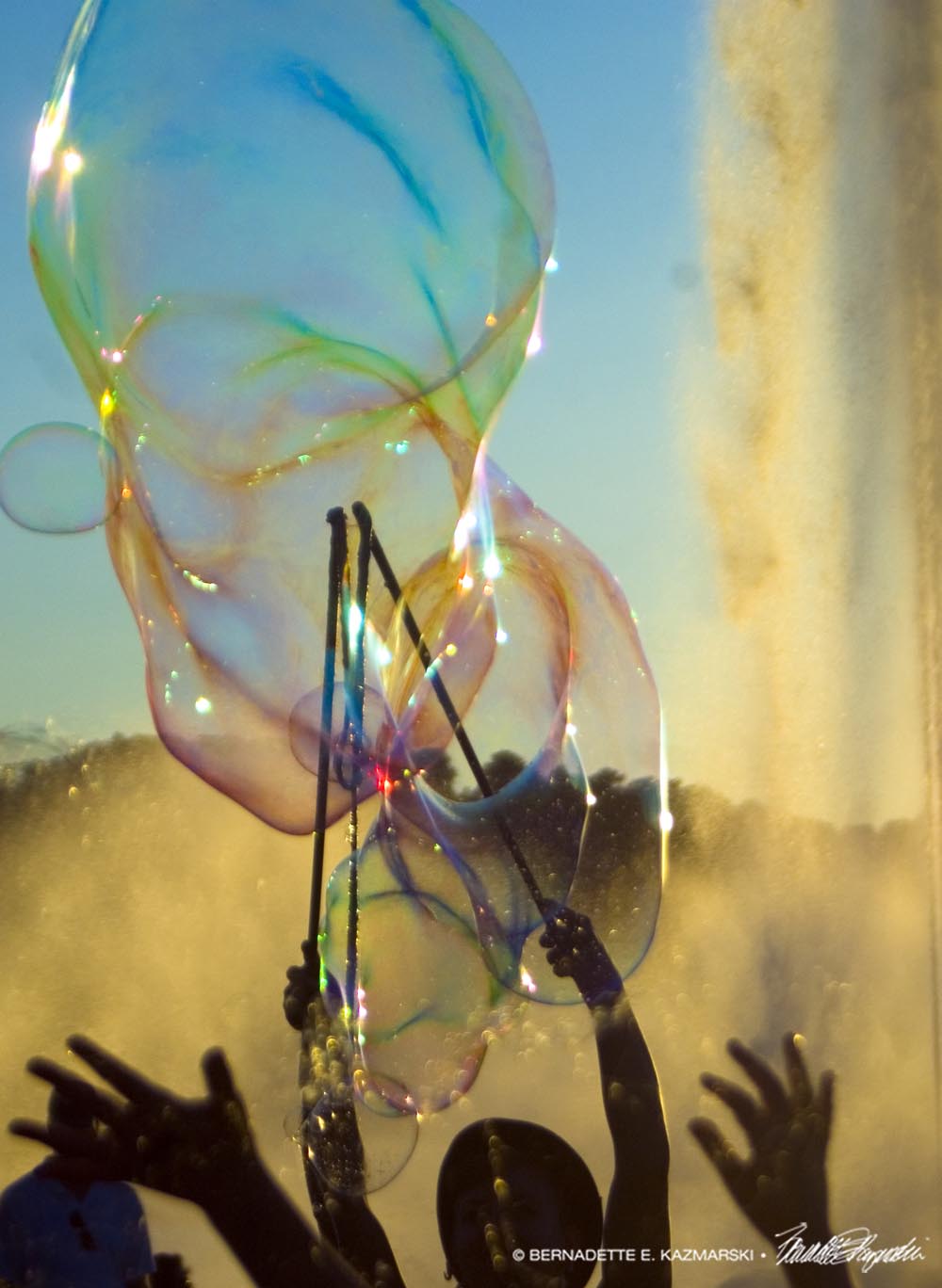 photo of hands and bubbles