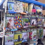 Display of garden flags at farmers market.