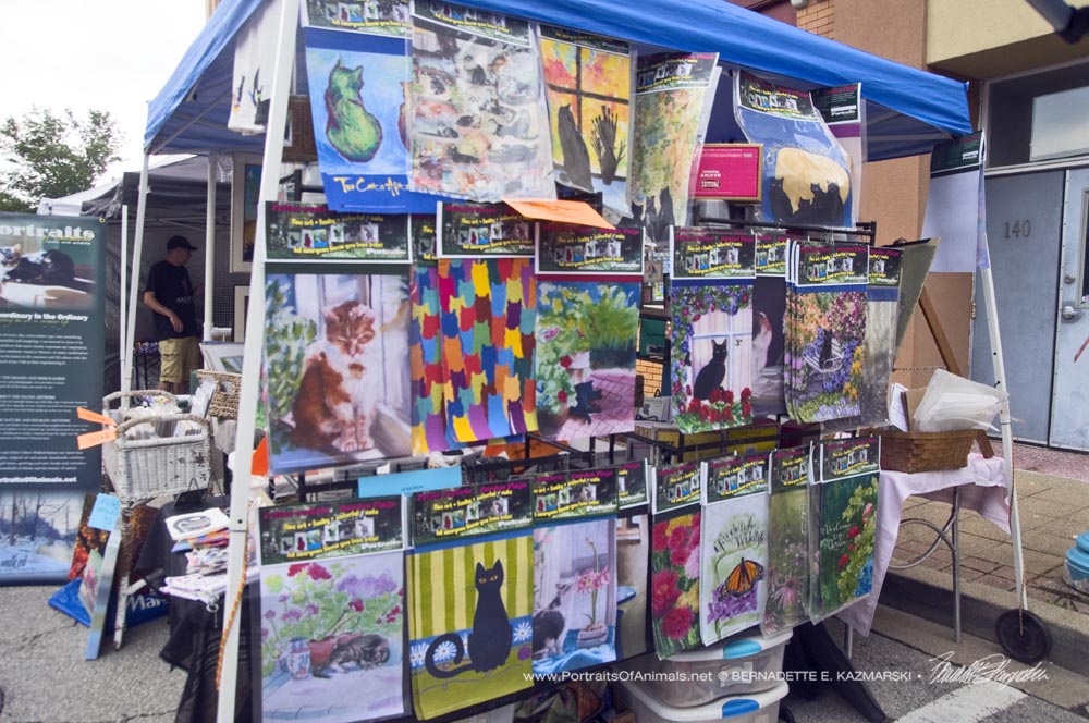 Display of garden flags at farmers market.