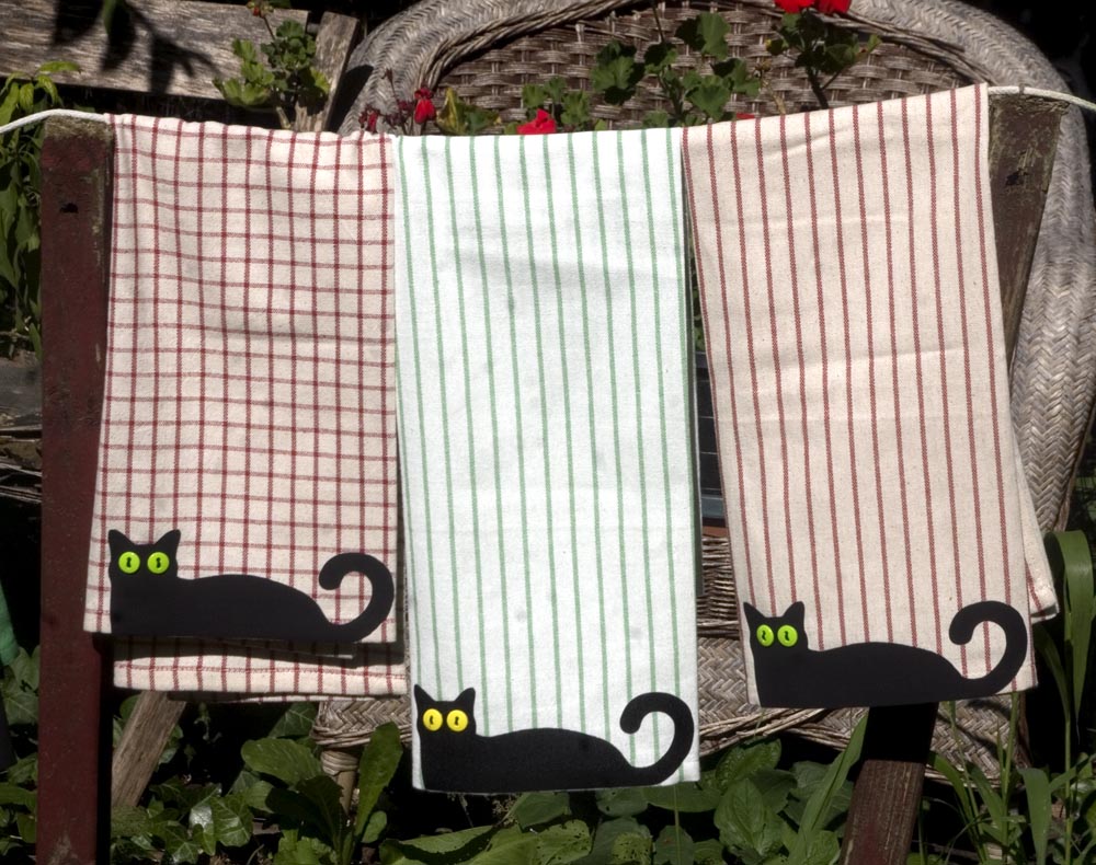 I saw a gingham dishtowel with a black cat silhouette printed on it and gave that a try Bella! on the white with black Rinnig towels at IKEA. When I went back for more I found all these colors!